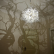 Illustration for article titled Chandelier casts a fantasy forest of shadows against the walls